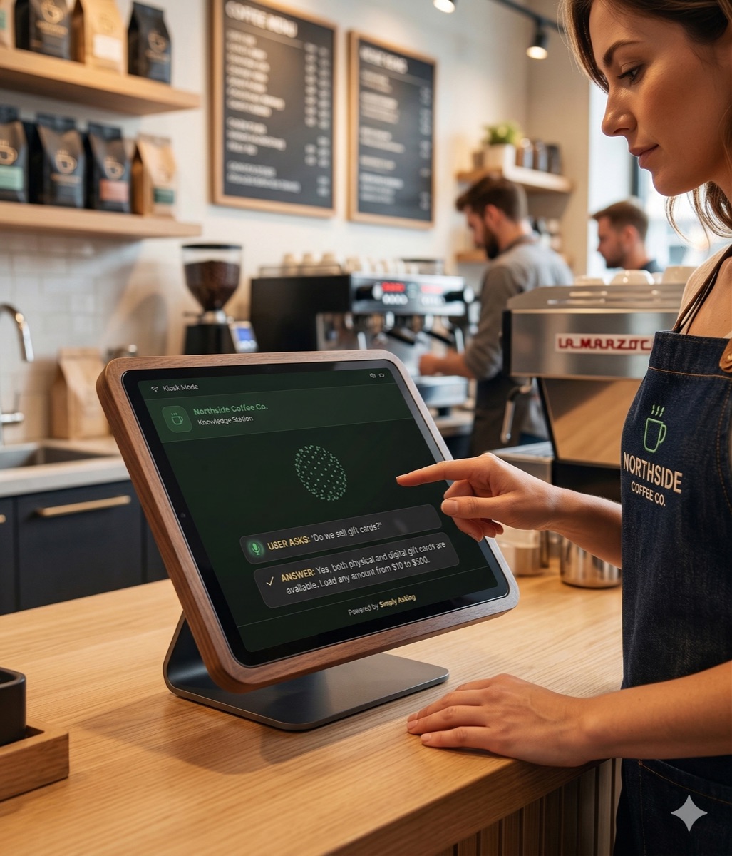 A barista using a Knowledge Station tablet at a coffee shop counter
